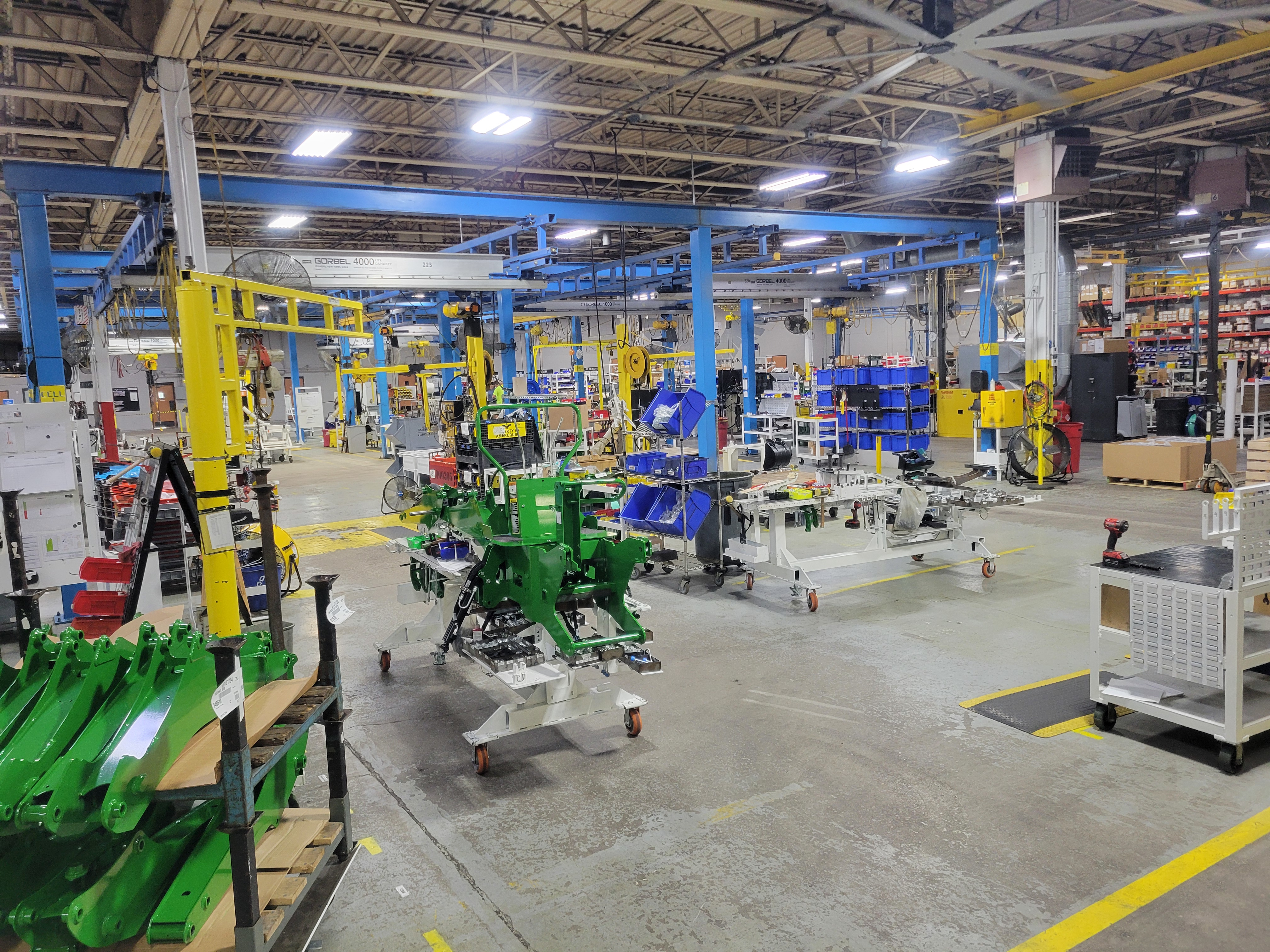 Amerequip's backhoe assembly area in the fall of 2023. Shows the 'right sizing' efforts to reduce inventory in the cell to only what is needed and focusing specifically on the operator's ability to fulfill their job responsibilities without needing to search for necessary parts and tools.