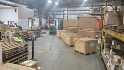 Amerquip's receiving dock, taken in 2021, before implementing 'The Toyota Way.' Shows the excessive amounts of materials hindering their ability to do business. The materials were getting in the way of getting the right things done.