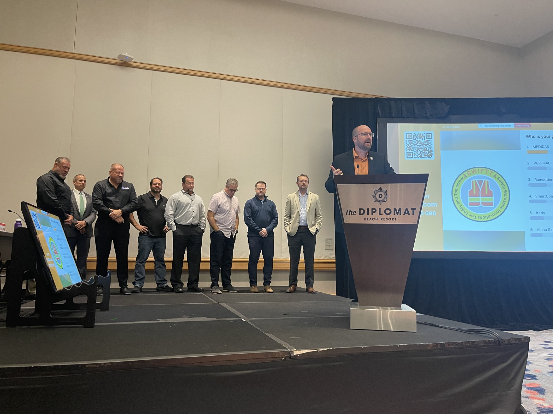 A photo from the SWIFTT event. The FDOT secretary is at the podium with the participants in the past (except Dan Hurtado, FDOT, second from left).