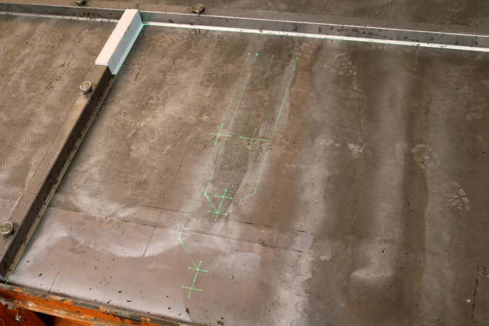 The laser project system can be permanently installed above a table or mounted on rails for long tracks.