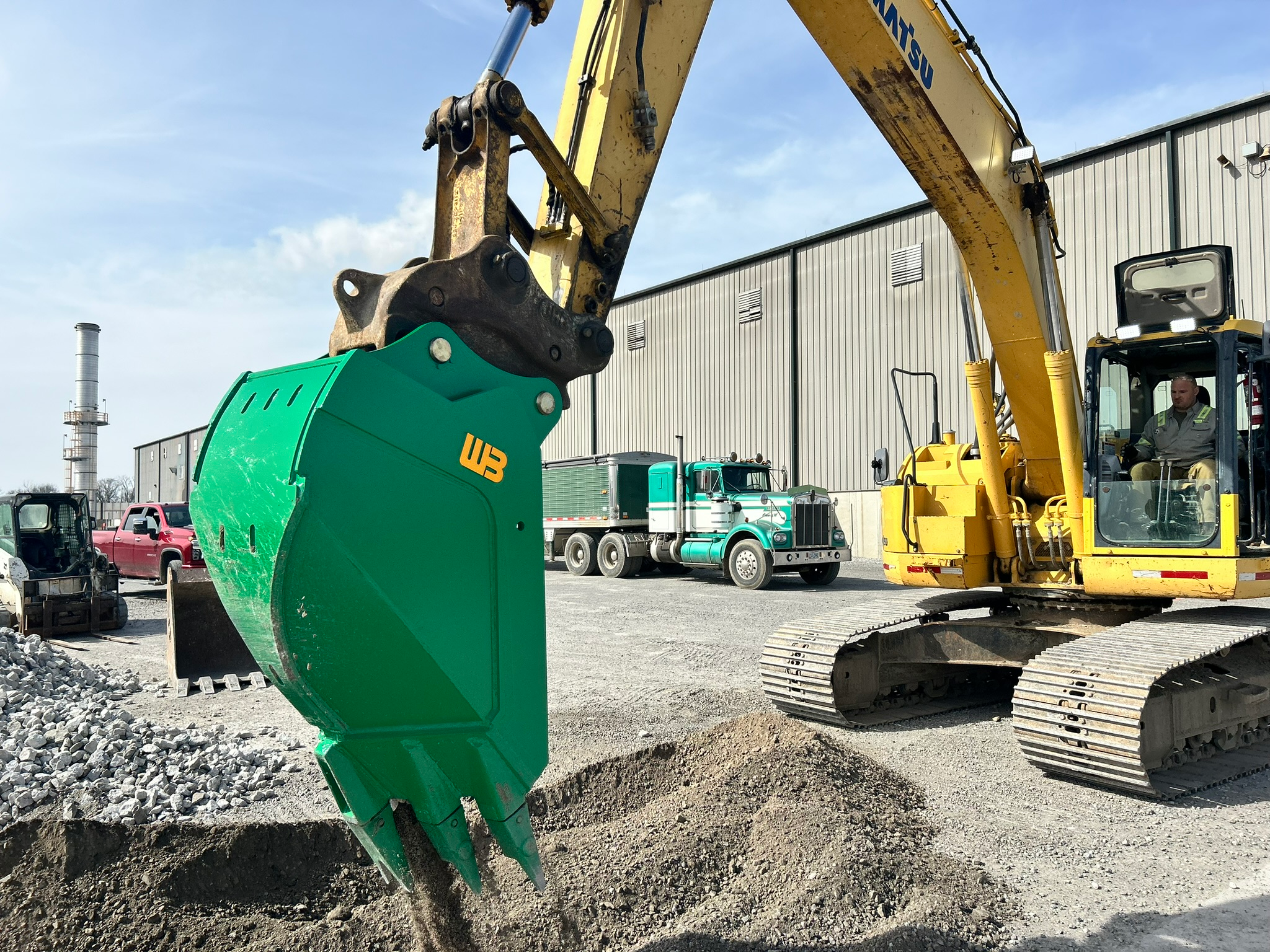 The Reverse V Bucket Attachment has tapered sides to reduce wear on bucket sides and to allow for dumping.