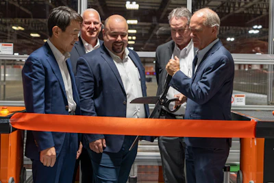 Toyota Material Handling held a ribbon-cutting ceremony for the company’s AutoStore installation within its Parts Distribution Center in Columbus, Indiana. Pictured (Front L-R): Bastian Solutions Chairman Hito Matsuoka, AutoStore Director of Sales - North America Joe Elie, and Toyota Material Handling North America President & CEO Brett Wood (Back L-R): Toyota Material Handling Vice President of Aftermarket Operations Bret Bruin and Toyota Material Handling President & CEO Bill Finerty.