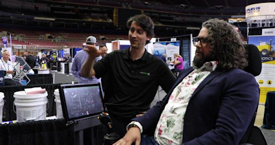 Editor Brandon Noel sits in the CM Labs multi-use simulator that was setup for excavator training, but can simulate 20 different machines.