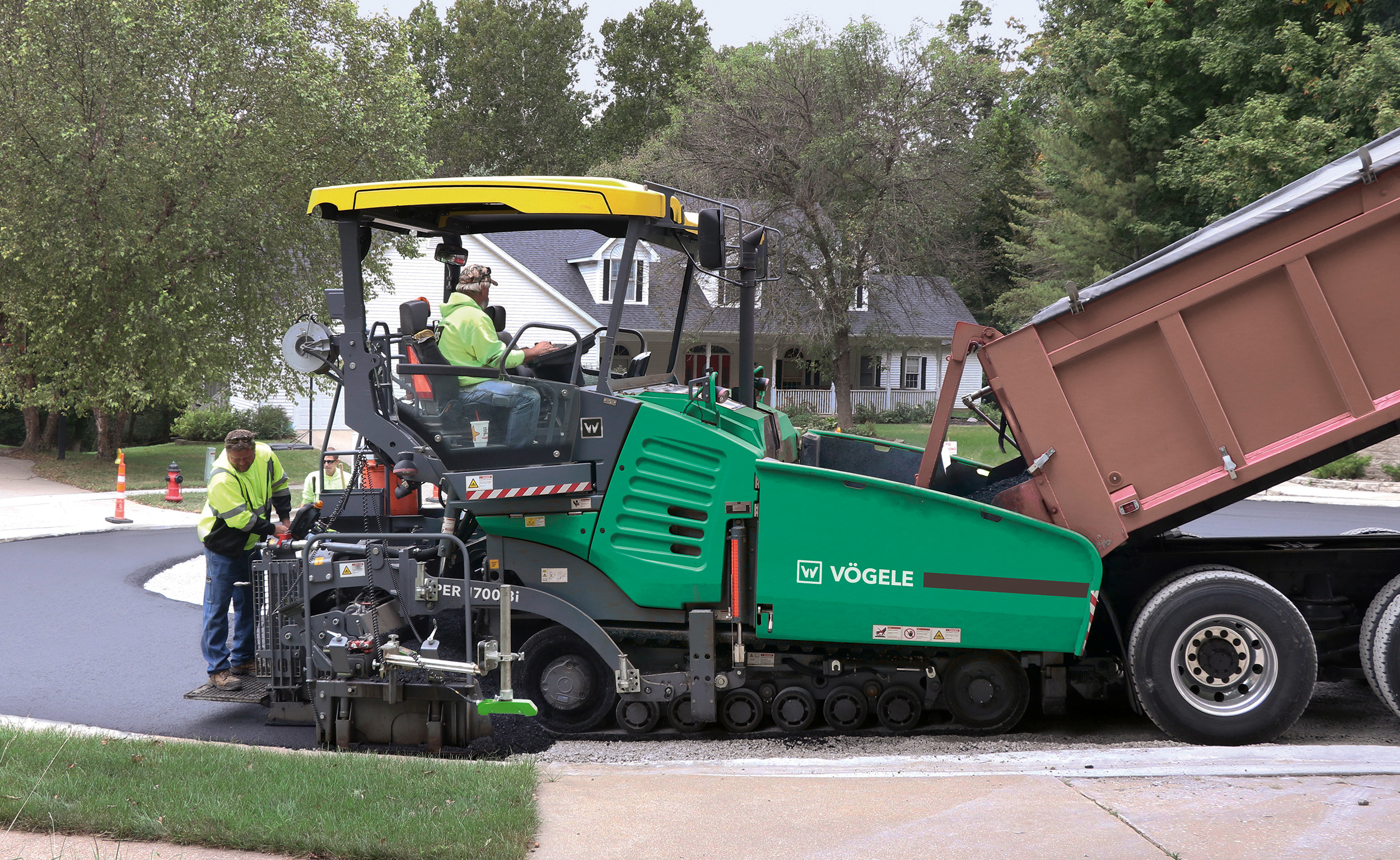 Vögele's Dash 3 pavers include a mobile feeder and additional screed. When the Vögele paver operator receives real-time survey info, they can adjust feeder speed or screed level. Fleet managers partner with operators to review datasets and identify where they can make changes.