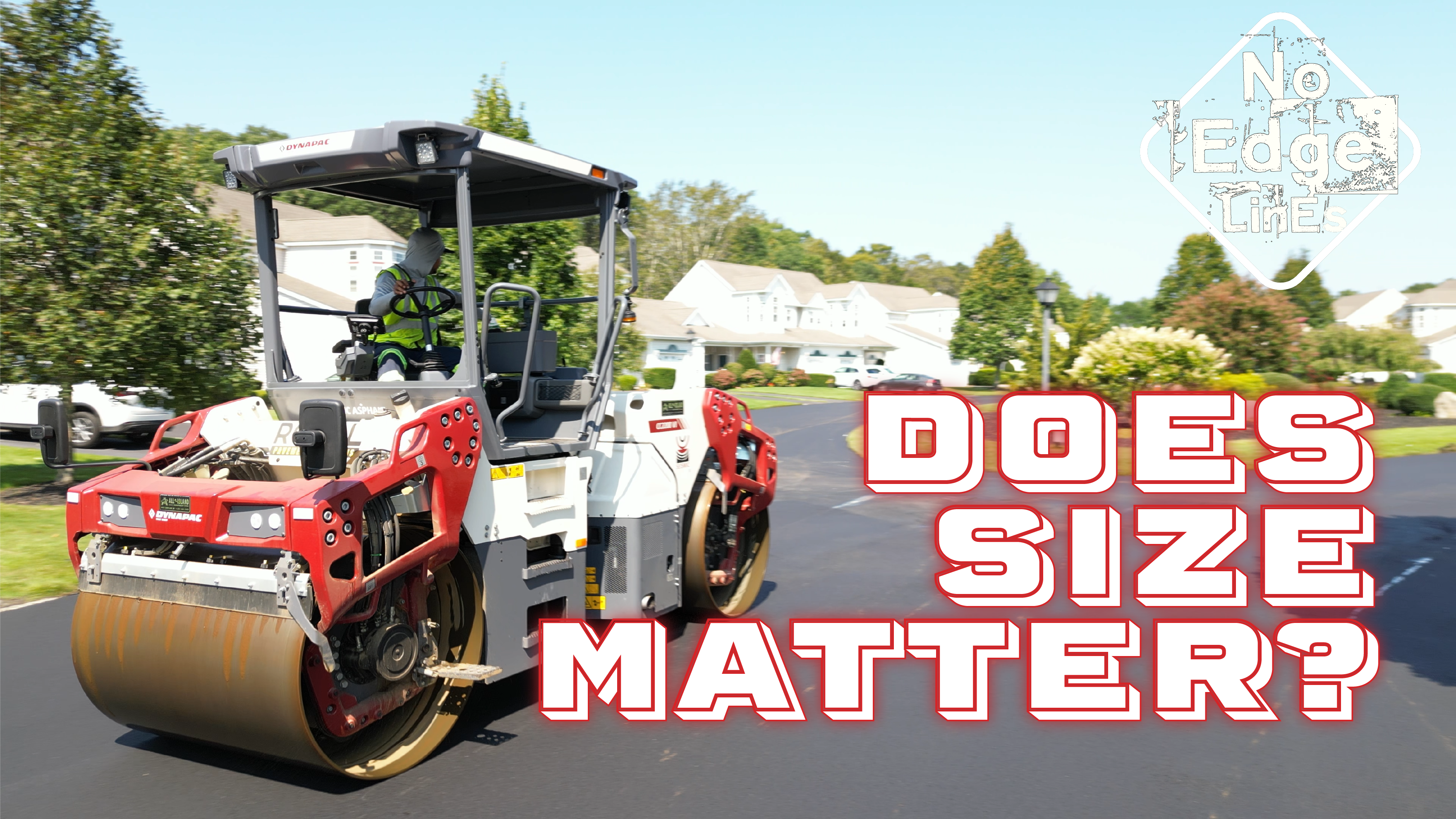 Road roller compacting asphalt on suburban street during pavement maintenance