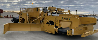 Yellow Weiler W730c road construction paver in industrial parking lot