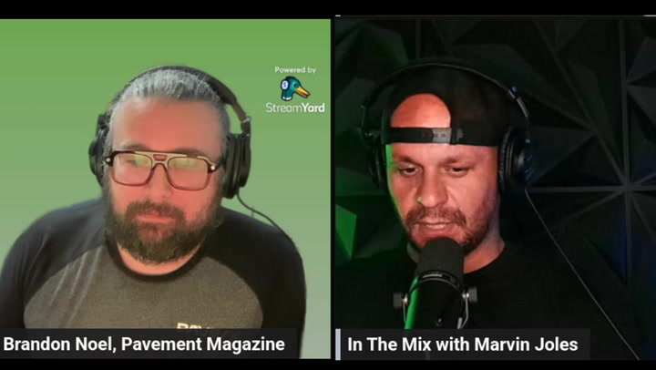Two podcast hosts in headphones during a livestreamed interview