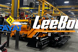 Yellow Leeboy paving machine in industrial manufacturing facility
