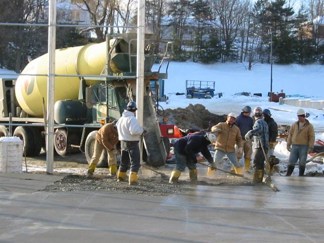 Concrete contractors work efficiently in freezing conditions, following ACI cold weather concreting guidelines to ensure proper placement, finishing, and protection.