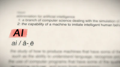 AI definition with stylized logo highlighting artificial intelligence concept