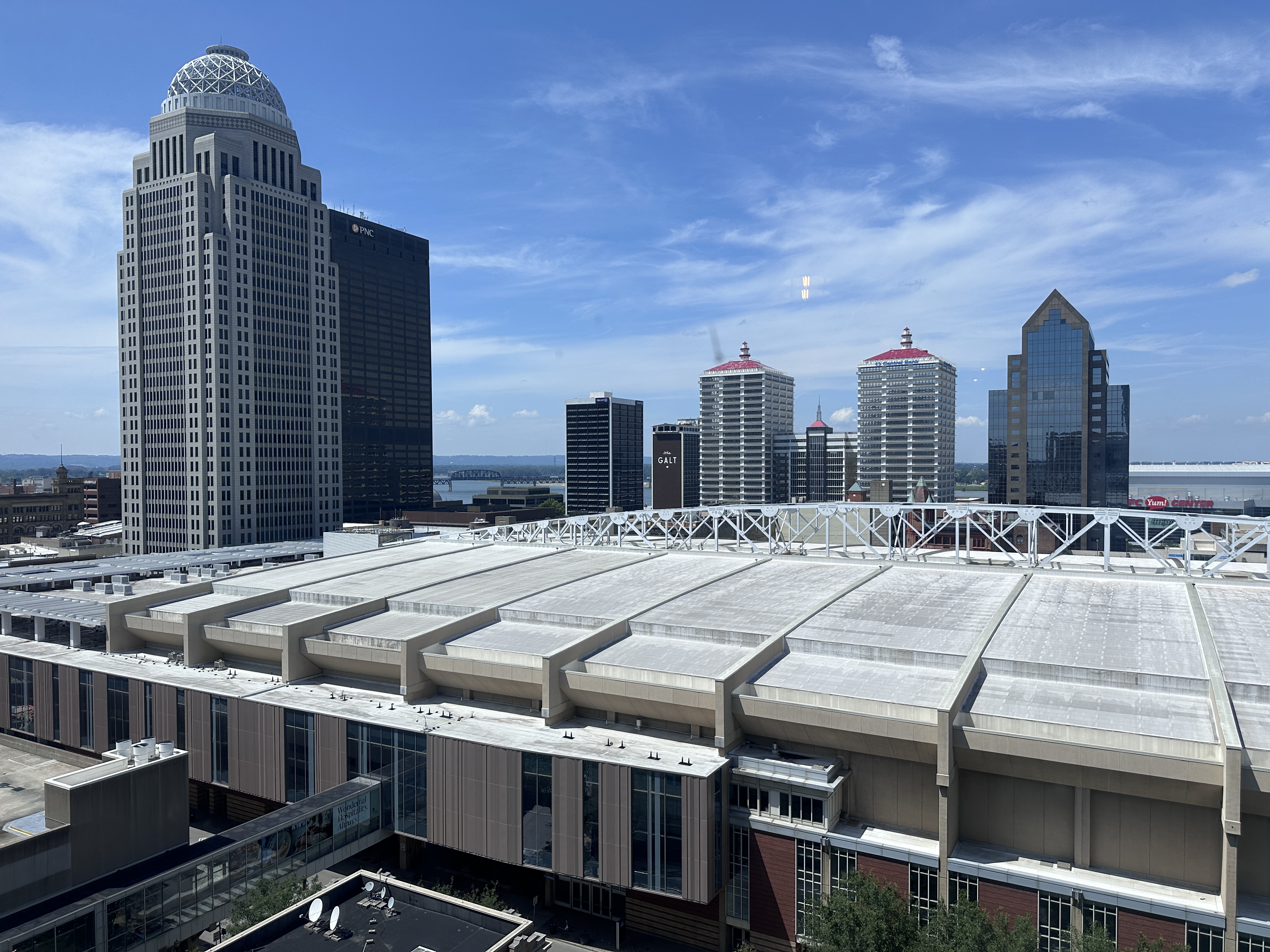 Louisville downtown skyline with modern skyscrapers and white convention center