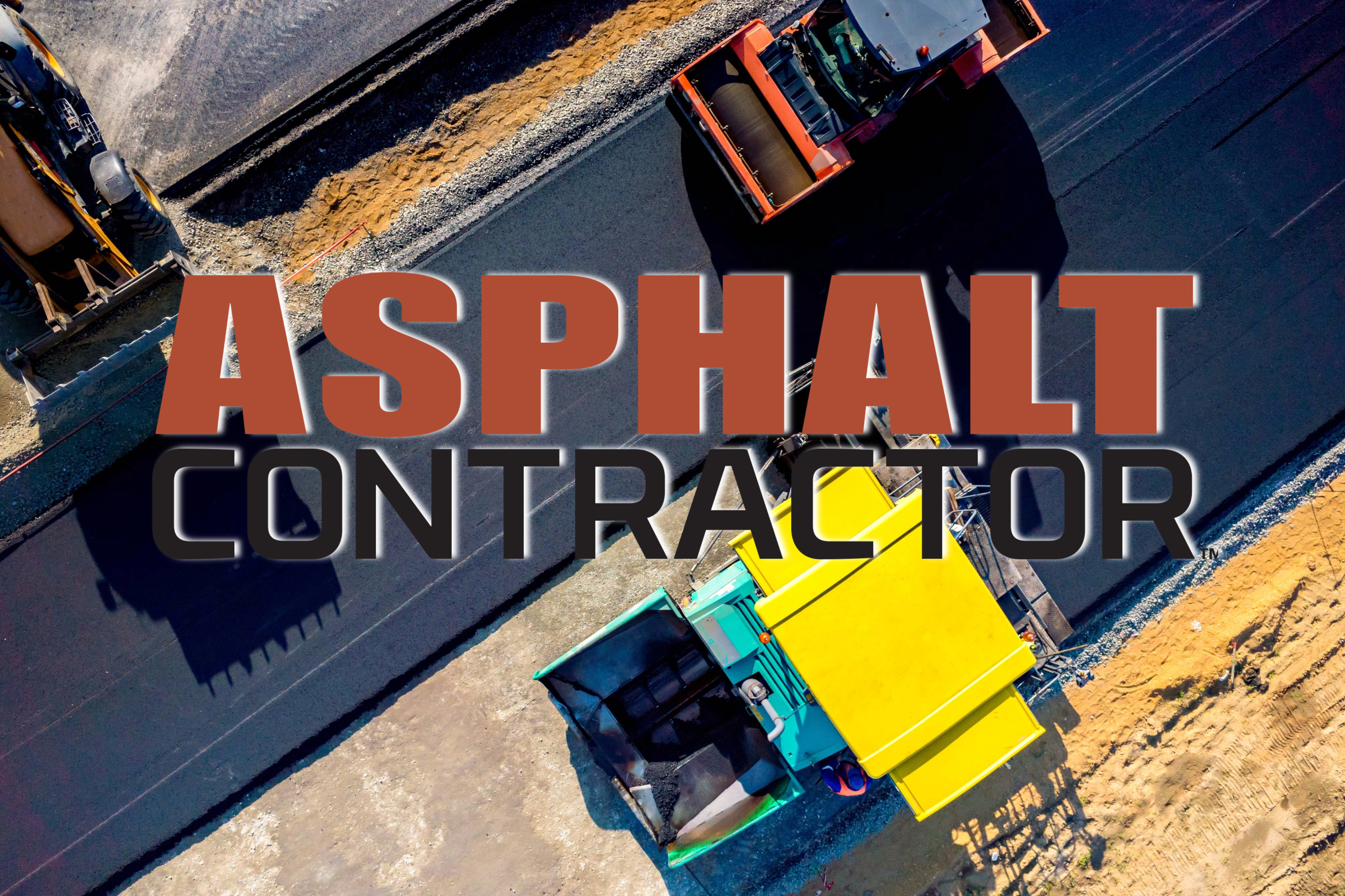 Aerial view of asphalt paving machines laying road surface in construction site
