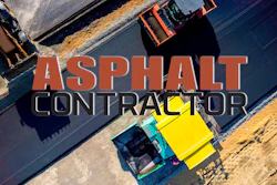 Aerial view of asphalt paving machines laying road surface in construction site