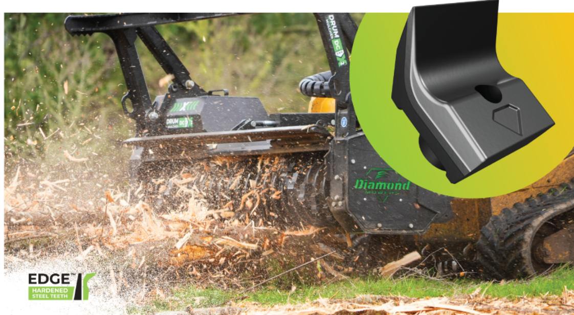 Industrial mulching machine clearing vegetation with wood chips flying