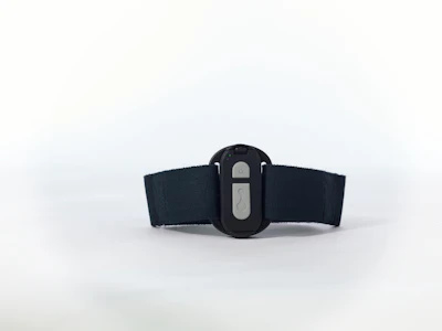 Black fitness tracker or wearable device with elastic band