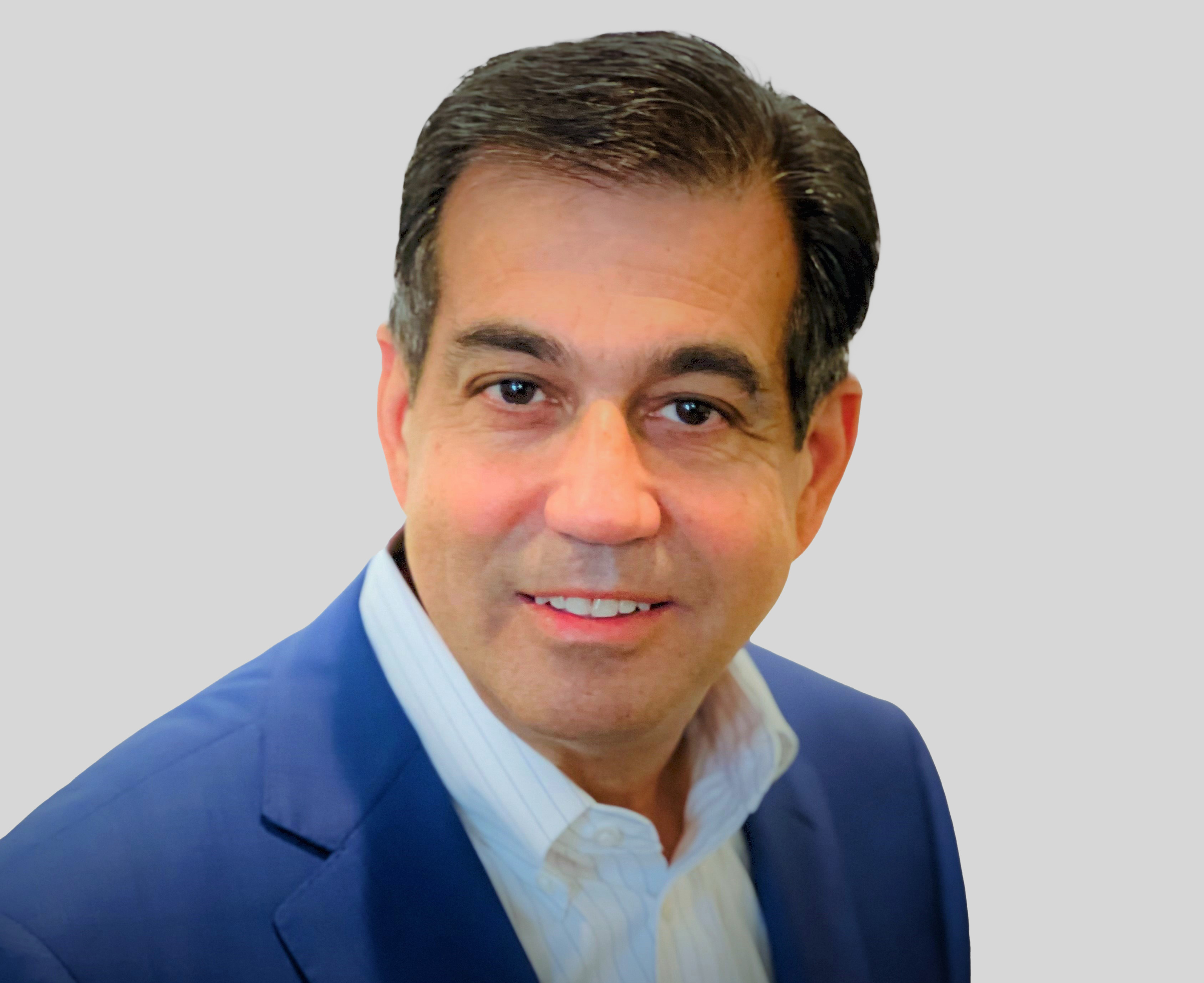 Professional businessman in blue blazer and white shirt smiling