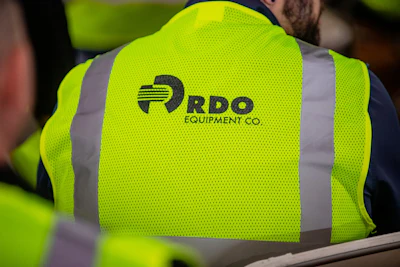 RDO Equipment Co. logo on bright safety vest with reflective stripes