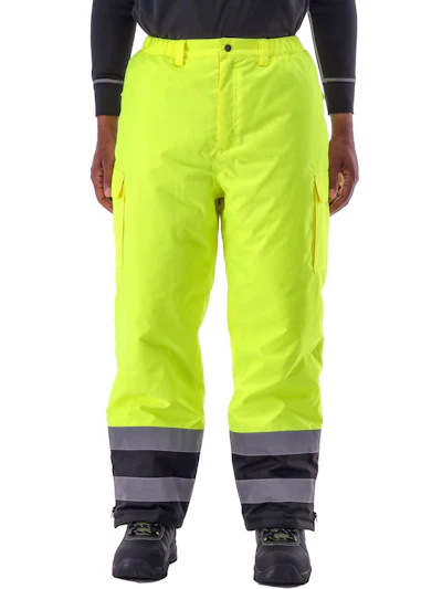 High-visibility safety pants in fluorescent yellow with reflective gray and black bands at bottom, featuring cargo pockets