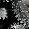 Close-up of interlocking metal gears with textured surfaces