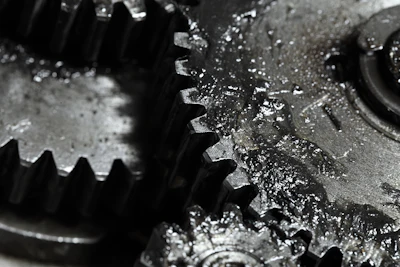 Close-up of interlocking metal gears with textured surfaces