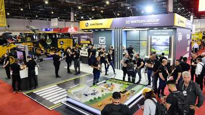 Construction equipment trade show with John Deere and Wirtgen Group displays