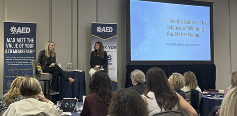 Conference presentation on status game with speaker and audience at AED event