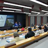 Corporate conference room with presentation about ASTEC Customer Tactics