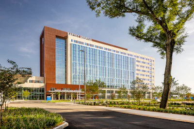 Baptist Hospital in Pensacola, FL, used a fully unitized prefabricated building envelope system that streamlined installation and ensured consistent quality across the facade.