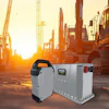 Industrial lithium batteries with construction equipment at sunset