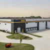 Modern industrial warehouse facility with multiple loading docks and landscaped entrance
