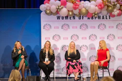 Women of Asphalt panel discussion with four women seated on stage with balloon arch