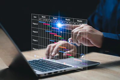 Project management Gantt chart displayed holographically over laptop keyboard
