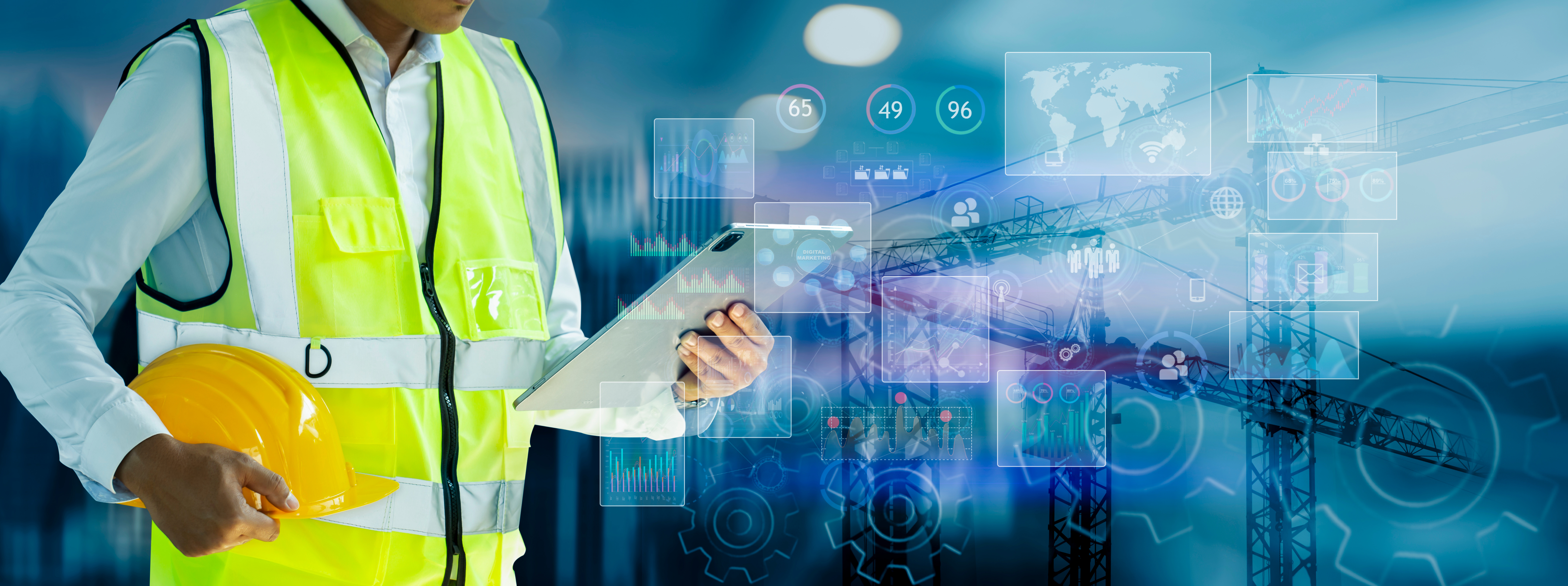 Construction professional with digital technology interface showing industrial data analytics