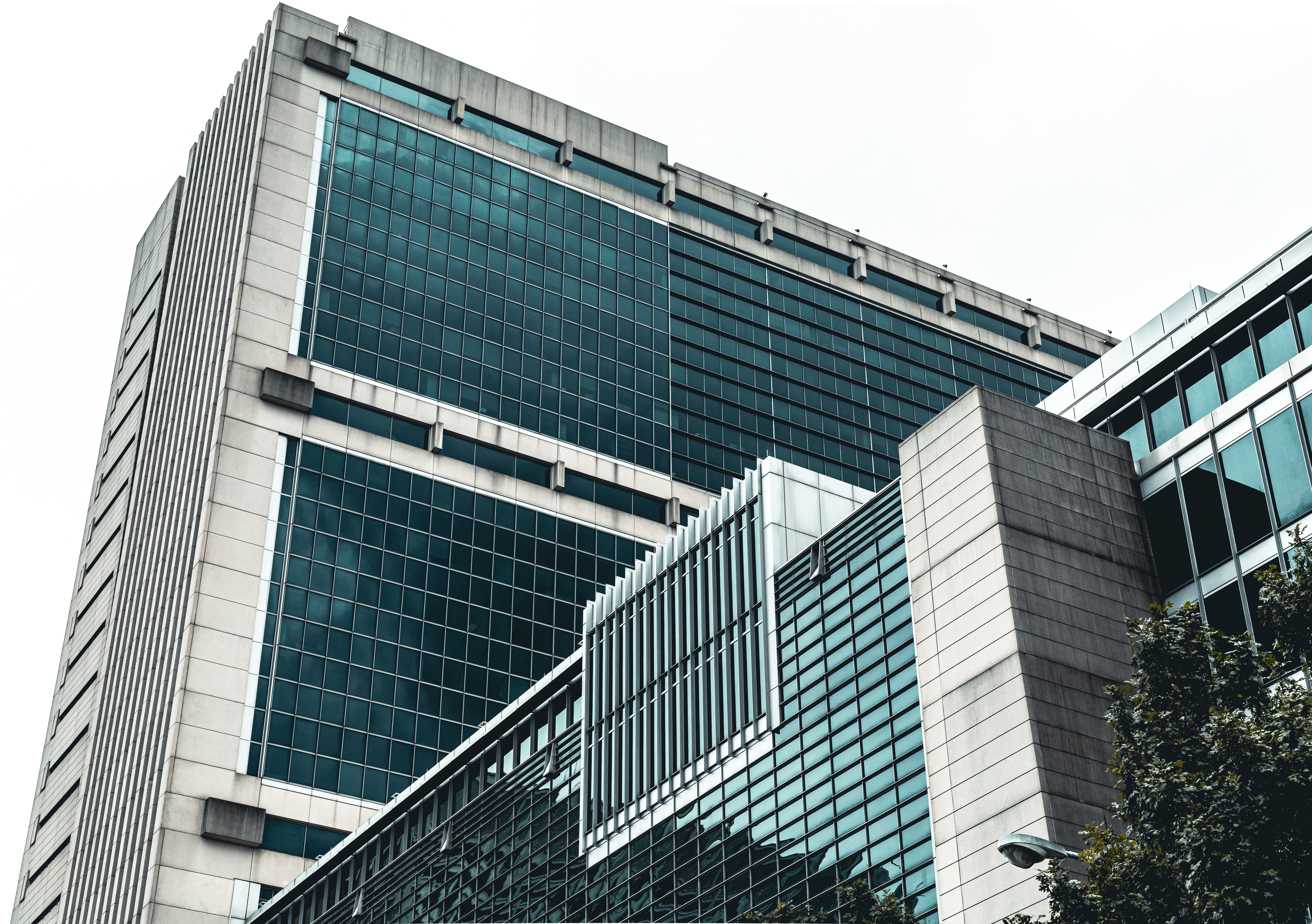 Modern glass and concrete office building with geometric architectural design