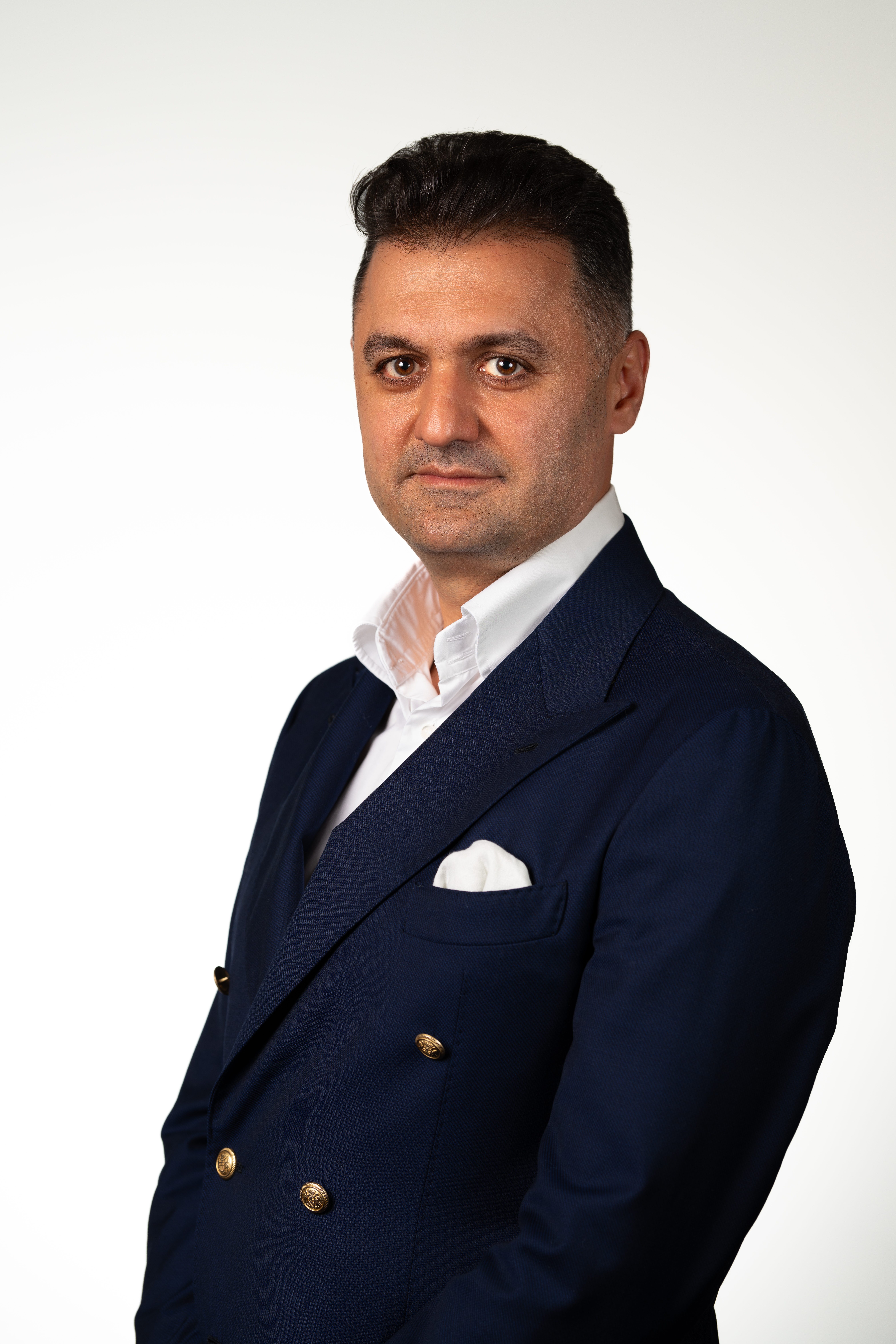 Professional man in navy double-breasted suit with white shirt Headshot