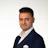 Professional man in navy double-breasted suit with white shirt Headshot