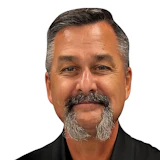 Middle-aged professional in black shirt with Ramtech Orama Group logo
