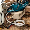 Blue Makita power tool on concrete blocks with white hose and construction debris