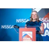 Woman speaking at NSSGA Young Leaders conference podium