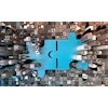 Blue puzzle piece connecting urban landscape, symbolizing technological integration