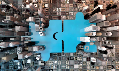 Blue puzzle piece connecting urban landscape, symbolizing technological integration