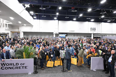 Crowded convention lobby at World of Concrete trade show with attendees