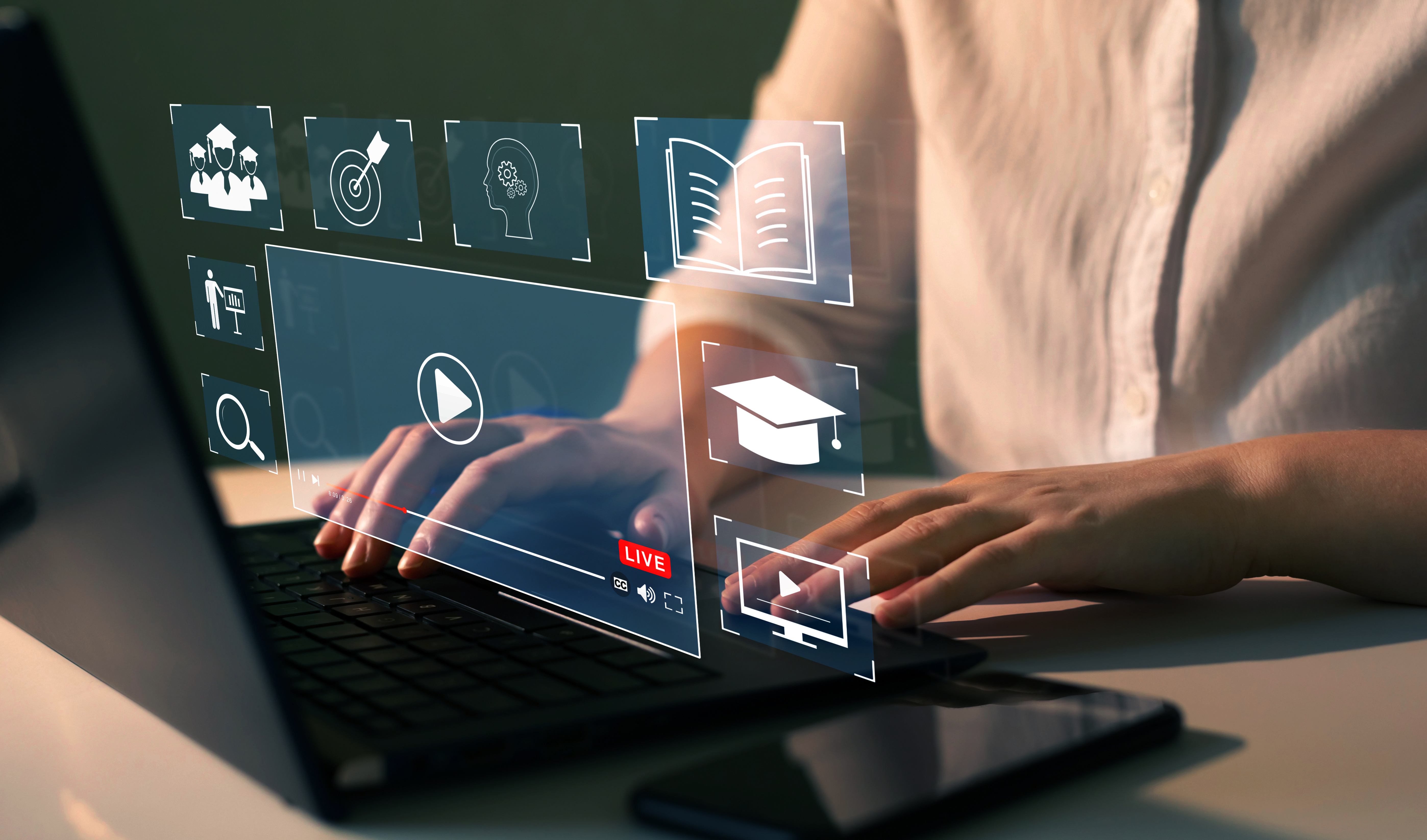 Digital learning interface with holographic icons showing online education technology