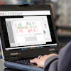 Panasonic laptop displaying data analysis graph in technical workspace