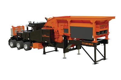 Large orange industrial crusher machine with multiple wheels and processing components
