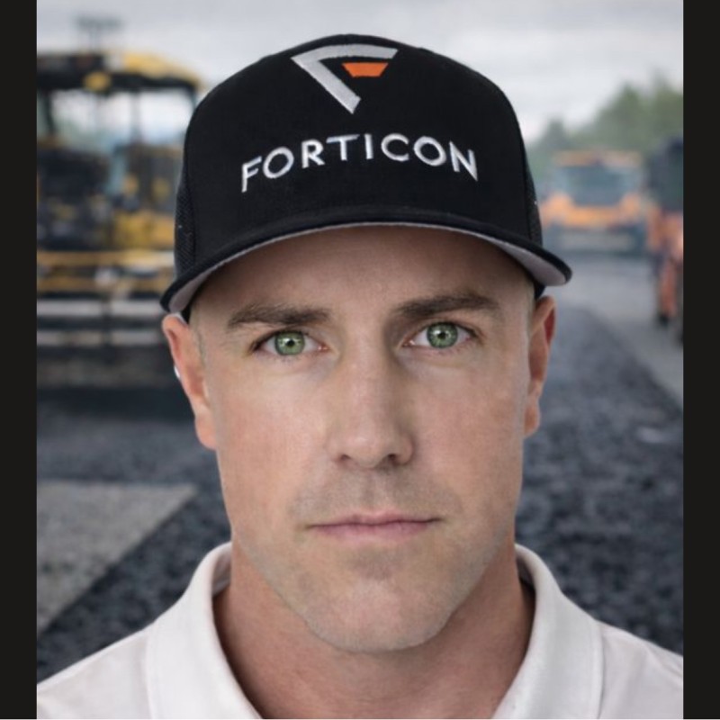Construction worker in Forticon cap on asphalt paving site Headshot