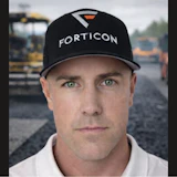 Construction worker in Forticon cap on asphalt paving site