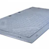 Gray metal industrial floor plate with mounting holes and textured surface