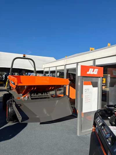 Orange JLG industrial machine on display at an outdoor exhibit