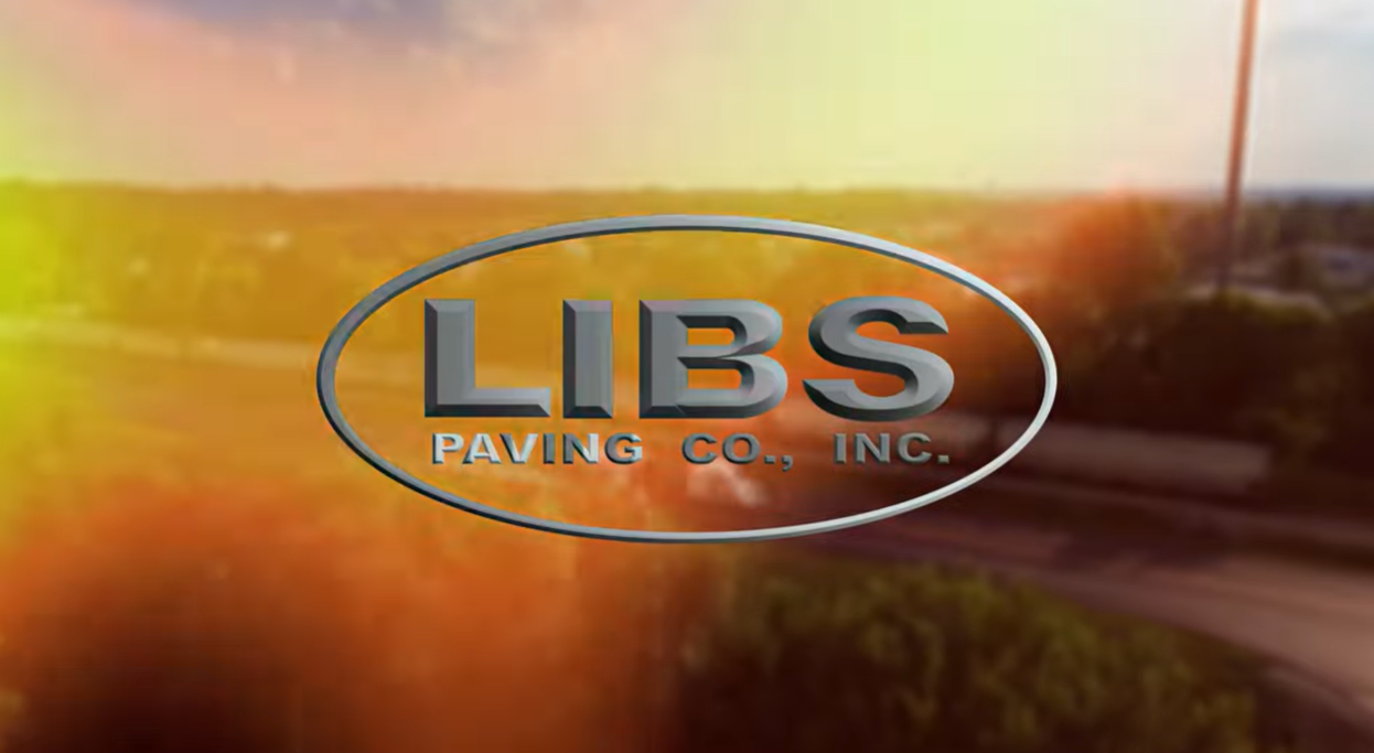Libs Paving Company metallic blue logo on sunset-colored background